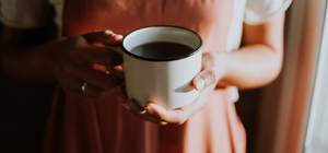 Woman holding a cup of coffee